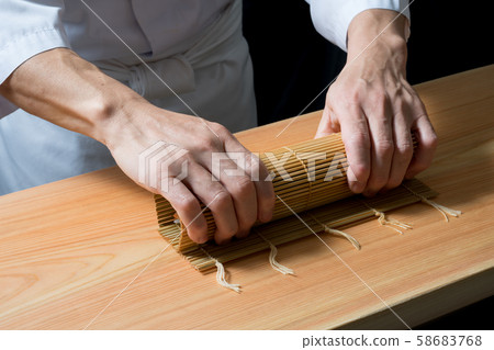 In front of the board to make thick rolls In front of the board to make thick rolls 58683768