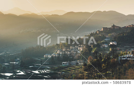 Small village and Terraced rice fields of YuanYang China in the morning 58683978