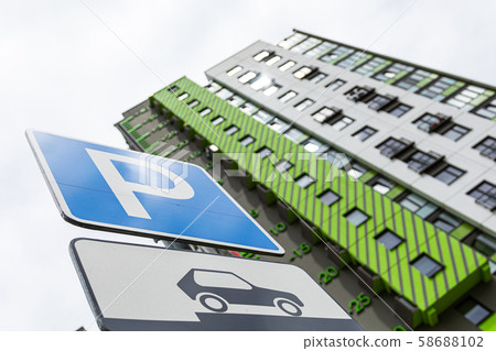 Bottom view of roadsign Way of parking vehicle against new block of flats Bottom view of roadsign Way of parking vehicle against new block of flats 58688102