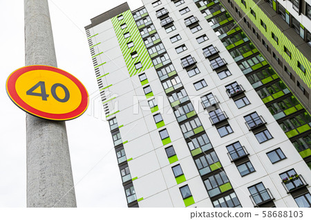 Bottom view of european roadsign Speed limitation forty against highrise 58688103