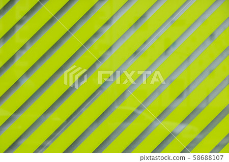 Glass surface with light green and transparent stripes Glass surface with light green and transparent stripes 58688107