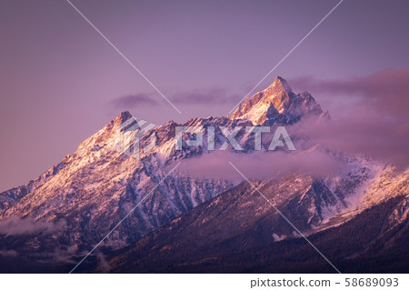 Colorful mountain peak of Grand Teton at sunrise 58689093