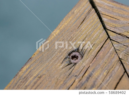 Screws screwdriver twist in wooden board. close up Screws screwdriver twist in wooden board. close up 58689402