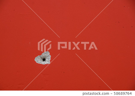 Drill a hole in the wall. hole in the cement 58689764