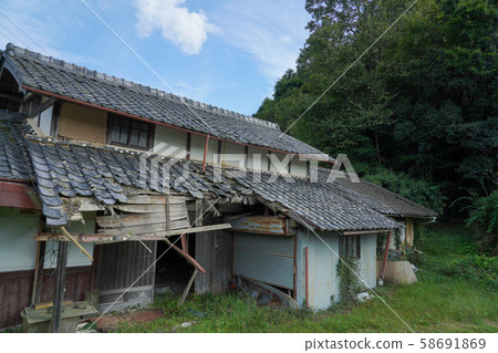 A rural house with an old roof A rural house with an old roof 58691869