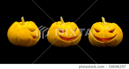 Jack o lantern pumpkin faces with lights on black background Jack o lantern pumpkin faces with lights on black background 58696297
