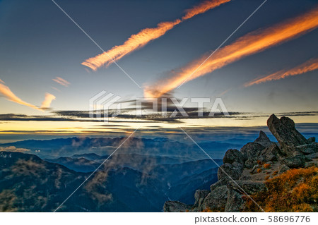 Central Alps and Gyoen in the sunset sky and afterglow seen from Mount Komagatake 58696776