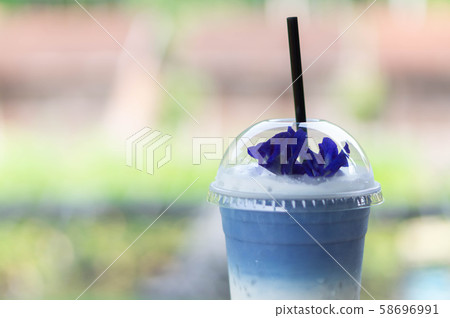 Closeup glass of ice butterfly pea latte with 58696991