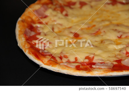 Fresh appetizing pizza with delicious ingredients Fresh appetizing pizza with delicious ingredients 58697540