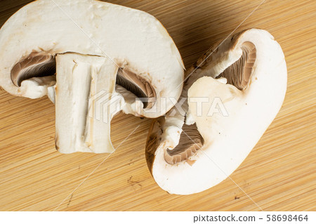 Fresh brown mushroom on light wood Fresh brown mushroom on light wood 58698464