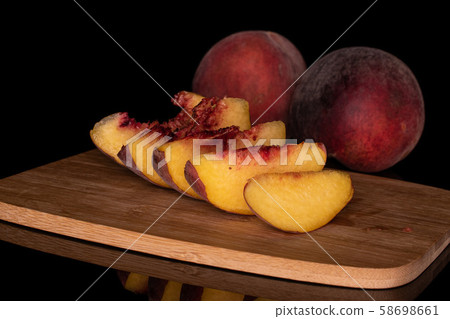 Sweet red peach isolated on black glass 58698661