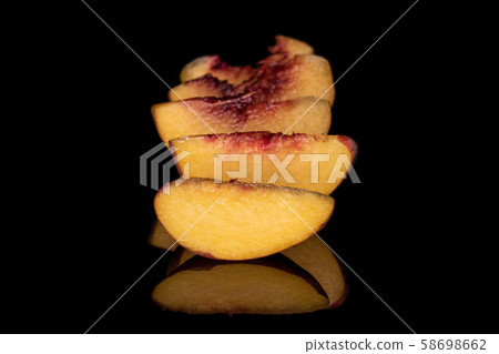 Sweet red peach isolated on black glass Sweet red peach isolated on black glass 58698662