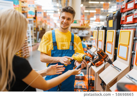 Consultant and female consumer in hardware store Consultant and female consumer in hardware store 58698665