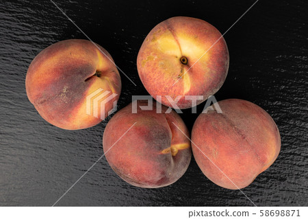 Sweet red peach on grey stone 58698871