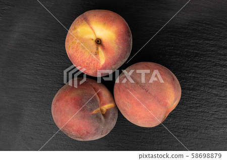Sweet red peach on grey stone Sweet red peach on grey stone 58698879