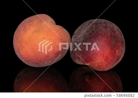 Sweet red peach isolated on black glass Sweet red peach isolated on black glass 58698882