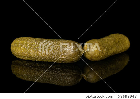 Sour green pickles isolated on black glass 58698948