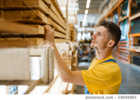 Builder choosing repair materials, hardware store Builder choosing repair materials, hardware store 58698965