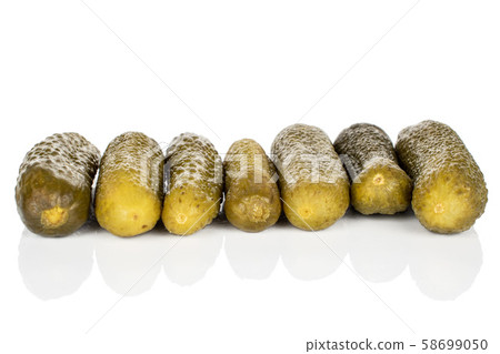 Sour green pickles isolated on white Sour green pickles isolated on white 58699050