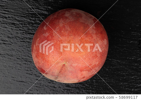 Sweet red peach on grey stone Sweet red peach on grey stone 58699117