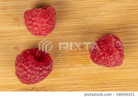 Fresh red raspberry on light wood Fresh red raspberry on light wood 58699201