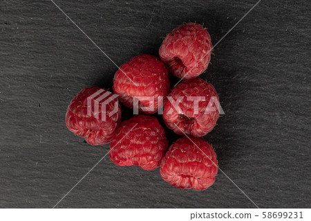 Fresh red raspberry on grey stone 58699231
