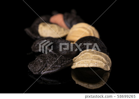 Pasta orecchiette isolated on black glass 58699265