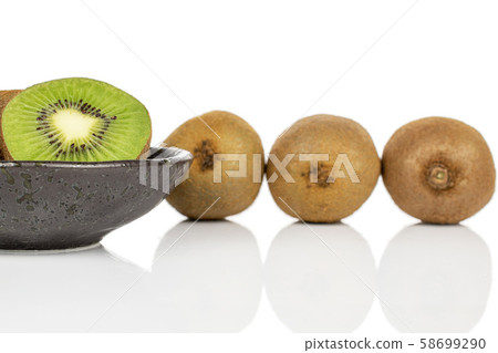 Exotic brown kiwifruit isolated on white Exotic brown kiwifruit isolated on white 58699290