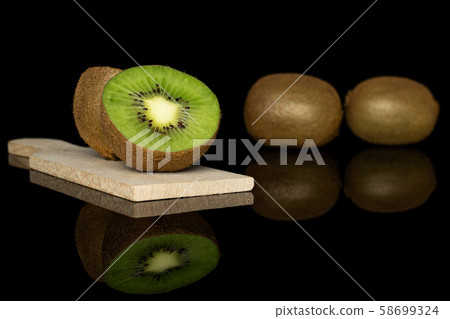 Exotic brown kiwifruit isolated on black glass Exotic brown kiwifruit isolated on black glass 58699324