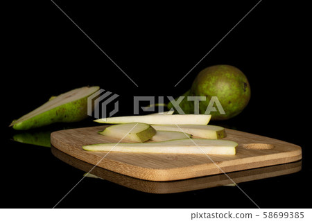Fresh green pear isolated on black glass 58699385