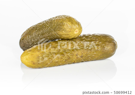 Sour green pickles isolated on white Sour green pickles isolated on white 58699412