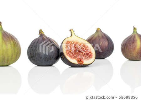 Sweet purple fig isolated on white Sweet purple fig isolated on white 58699856