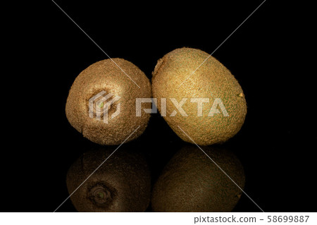 Exotic brown kiwifruit isolated on black glass Exotic brown kiwifruit isolated on black glass 58699887
