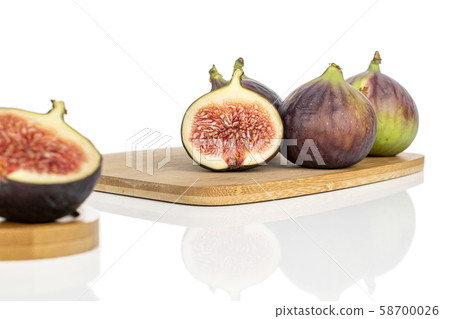 Sweet purple fig isolated on white Sweet purple fig isolated on white 58700026