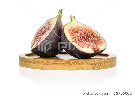 Sweet purple fig isolated on white Sweet purple fig isolated on white 58700069