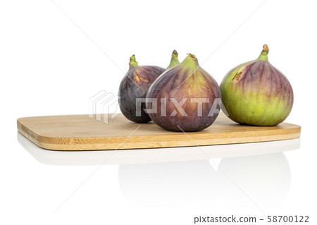 Sweet purple fig isolated on white Sweet purple fig isolated on white 58700122