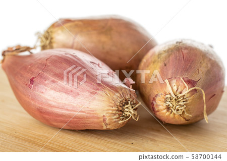Fresh brown shallot isolated on white Fresh brown shallot isolated on white 58700144