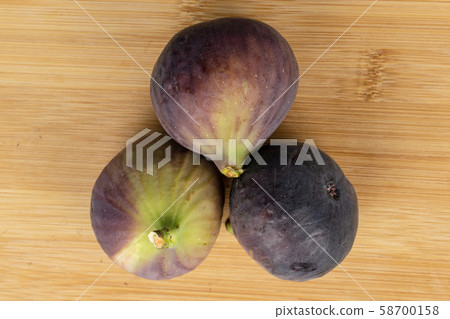 Sweet purple fig on light wood Sweet purple fig on light wood 58700158