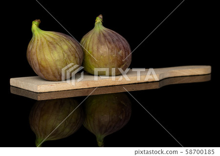 Sweet purple fig isolated on black glass Sweet purple fig isolated on black glass 58700185