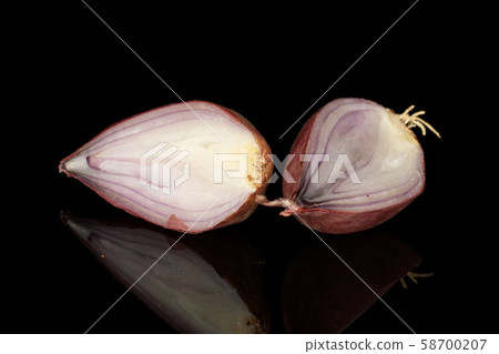Fresh brown shallot isolated on black glass 58700207