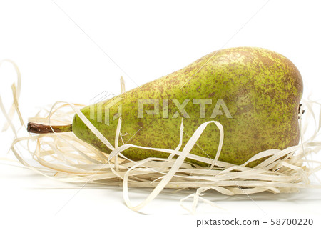 Fresh green conference pear isolated on white Fresh green conference pear isolated on white 58700220