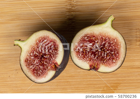 Sweet purple fig on light wood Sweet purple fig on light wood 58700236