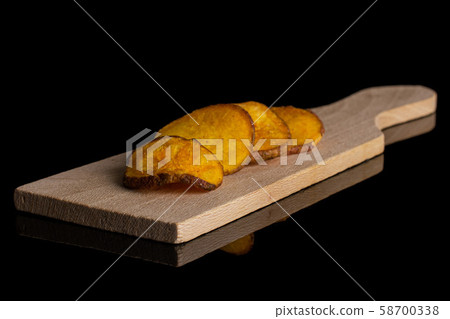 Dried vegetable chips isolated on black glass 58700338