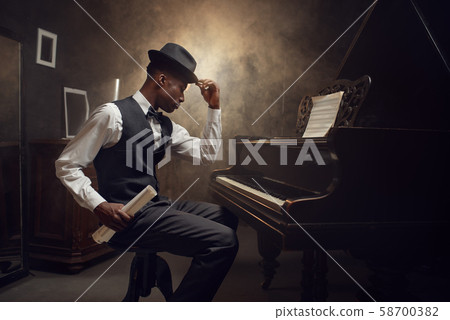 Black grand piano player, jazz musician 58700382