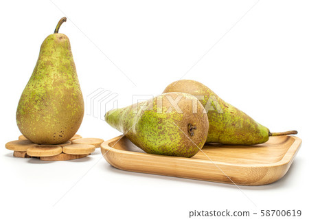 Fresh green conference pear isolated on white Fresh green conference pear isolated on white 58700619