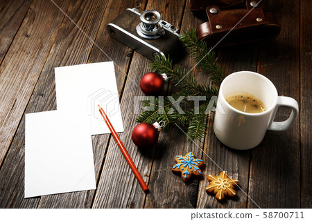 Photos, camera, pine tree branch and cup of coffee 58700711