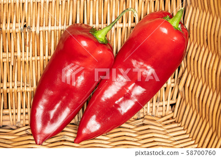 Sweet red bell pepper with braided rattan Sweet red bell pepper with braided rattan 58700760