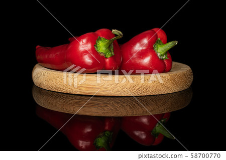 Sweet red bell pepper isolated on black glass 58700770