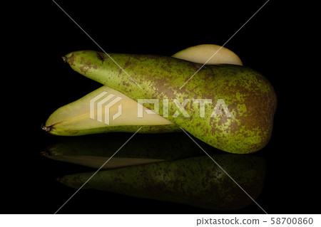Fresh green conference pear isolated on black glass 58700860