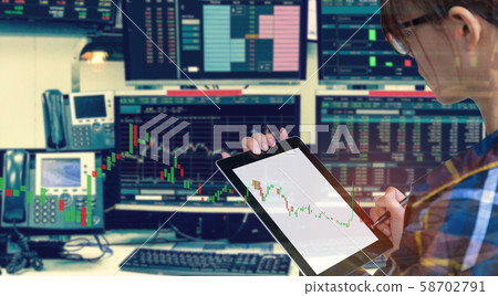 Double exposure of business woman using tablet 58702791